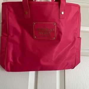New preowned Victoria Secret tote bag in pink color with magnetic snap .